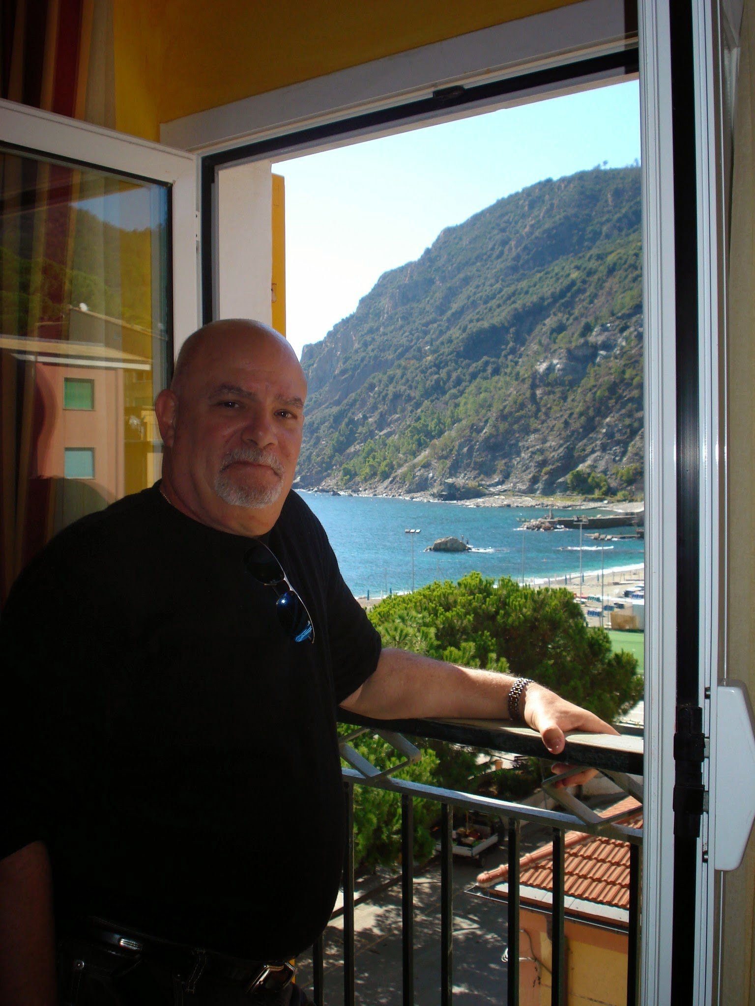 Gary out our window in the hotel in Cinque Terre, Italy. ouritalianjourney.com