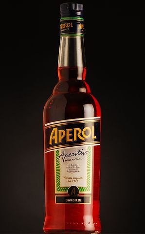 Aperol Spritz is a refreshing bright orange cocktail. ouritalianjourney.com