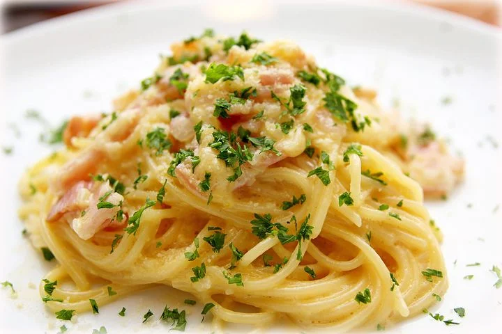 Carbonara is pasta made with eggs and is amazing. ouritalianjourney.com