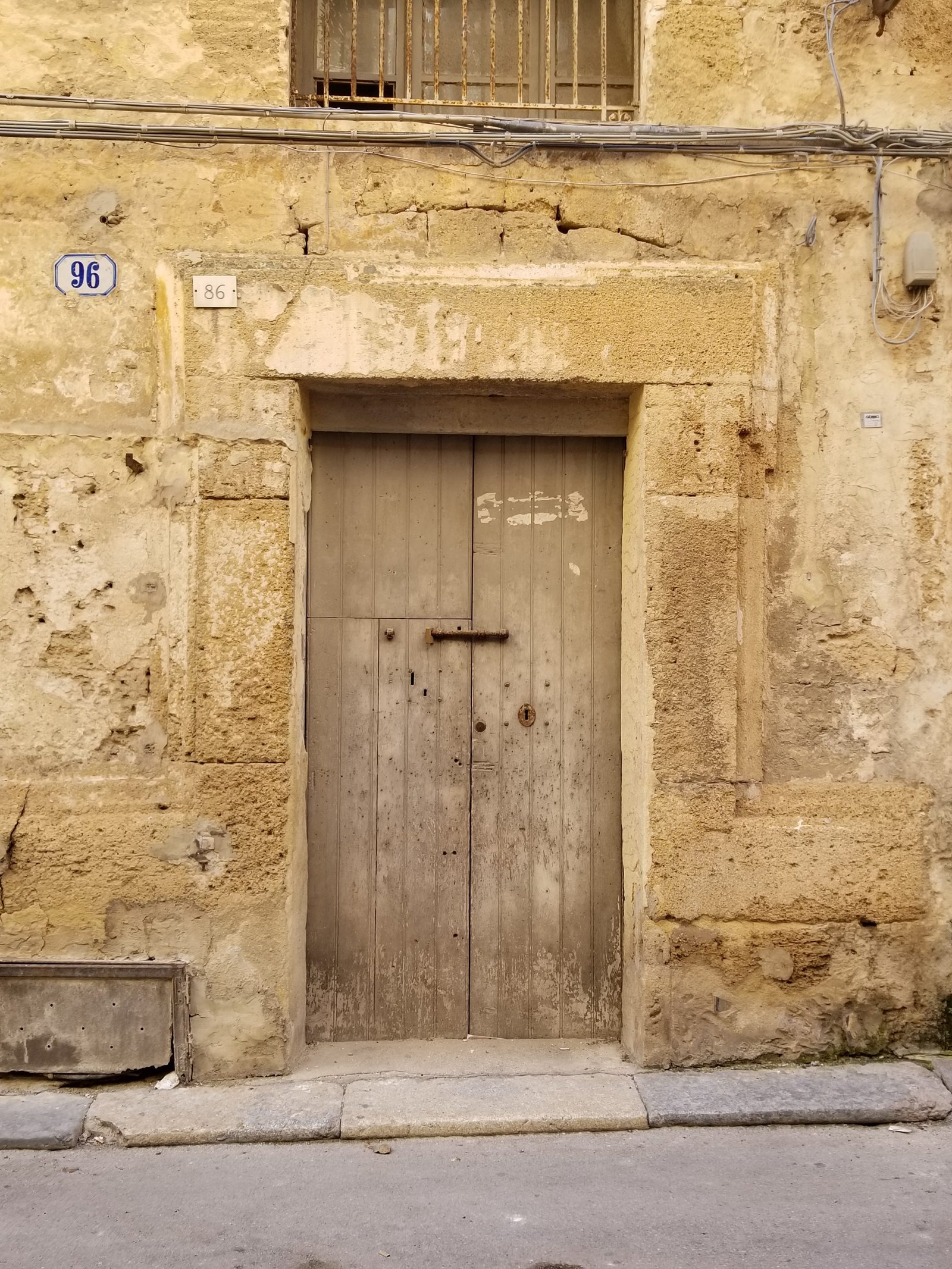Town of Marsala, Sicily, more than wine and salt flats, ouritalianjourney.com, wooden door