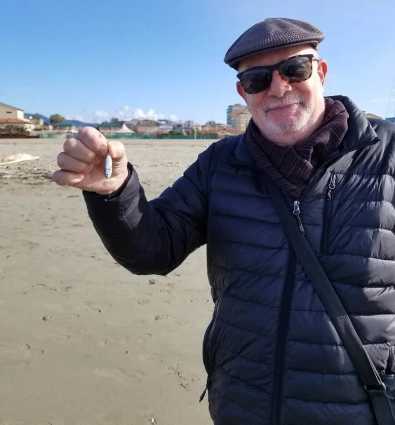 Viareggio, Italy beautiful beach, harbor and view of Carrara mountains. ouritalianjourney.com https://ouritalianjourney.com/viareggio-beach-italy