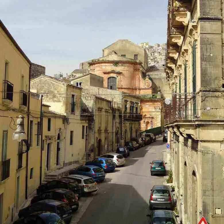street in Modica, Sicily: Discover the beauty and our funny true story. ouritalianjourney.com