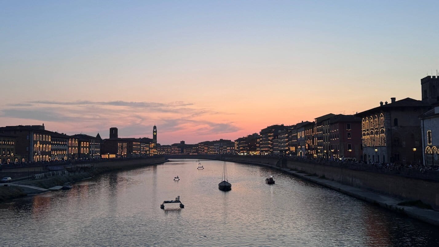 The Luminara of San Ranieri in Pisa is a festival that shouldn't be missed - but held one day a year - a beautiful sunet over the Arno River - ouritalianjourney.com